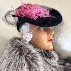 What A Stunner!!! This Hat From The 1930s' Is Made Of A Very Fine Velour Felt. The Flat Top Is Adorned By 3 Different Colored Ostrich Feathers: Fuchsia, Pink And Grey. There Is A Cap At The Back Under The Flat Top, Which Holds This Tilt Hat In Place. This Cap Has Two Openings At Each Side, As Shown In The Photos, To Add More Drama To This Visually Stunning Hat. To Finish The Look, There Is A Large Black Veil, Which Ends In Two Streamers At The Back. Tilt Hats Were Popular In The 1930s And 1940s. They Were Worn At An Angle And Held To The Back Of The Head By A Strap, Rigid Ring, Elastic Band Beneath The Hair, Or A Combination Of These. Store Label: Carson, Pirie Scott & Co. - Chicago There Black Brimmed Mini Hats For Vintage Events, Vintage Pink Fitted Fascinator, Vintage Black Costume Hats For Spring, Retro Black Hat For Vintage Events, Vintage Pink Hat For Evening, Vintage Black Mini Hat For Spring, Vintage Pink Mini Hat With Short Brim, Vintage Pink Evening Hat, Vintage Pink Brimmed Mini Hats