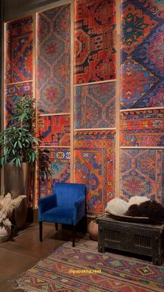 a living room filled with lots of colorful rugs and furniture next to a potted plant