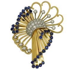 Vintage sapphire and diamond brooch set in 18ct gold (tested); this is a fine example of mid century craftsmanship and typifies the elegance of jewellery from that era.  This beautiful brooch would have been worn by an elegant lady for a lunch date or cocktail party.  It is formed of a floral garland of Brilliant cut diamonds linked by a pavé of diamonds and a ribbon motif set with sapphires of an intense blue shade.  Total diamond weight: 1.20ct; sapphire weight: 2.24ct.  Tested as 18ct gold.  Weight: 23.5gm.  To the reverse the brooch is fitted with a pin and swivel lock closure.  Measurements: 6cm x 4.5cm (2 1/2″ x 2″).  The brooch is in excellent condition and dates from the 1950s.  Ref:  L067 Specifications Metal: 18ct Gold (Tested) Diamonds: 1.20ct Sapphires: 2.24ct Weight: 23.5gm Er Vintage Blue Diamond Brooches, Vintage Blue Diamond Brooch, Blue Art Deco Formal Brooch, Wedding Brooches, Vintage Sapphire, Lunch Date, Gold Brooch, Elegant Lady, Wedding Brooch