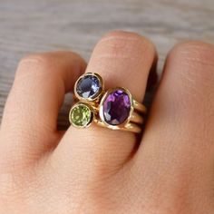 Onegarnetgirl, your designs are awesome!!! Oval Multi-stone Peridot Gemstones, Oval Multi-stone Yellow Gold Birthstone Ring, Gold Oval Multi-stone Birthstone Ring, Yellow Gold Oval Birthstone Ring Stackable, Oval Birthstone Gemstones In 14k Gold, Oval Amethyst Birthstone Ring In Yellow Gold, Oval Yellow Gold Birthstone Ring With Gemstone Accents, Green Oval Amethyst Ring For Anniversary, Green Amethyst Oval Ring For Anniversary