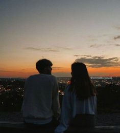 two people sitting on a bench looking out at the city lights in the distance, with text that reads every summer has a story