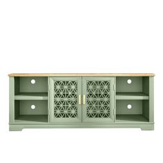 the sideboard is painted green and has an intricate design on it's doors