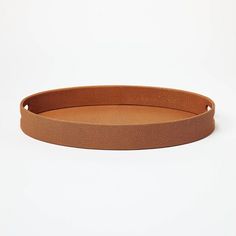 a round leather tray on a white background