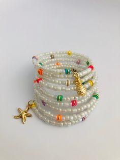 "Memory wire bracelets are an simple way to create a beautiful stack with very minimal effort.  - Features 2.4\" diameter stainless steel bracelet memory wire in silver. - 8 beaded Strands Memory wire means that your bracelet is easy to put on and take off; it just wraps around your wrist, no clasp! 👉Ships in 1 day or Same day🌷 All of our bracelets come gift wrapped in a complimentary organza bag and box. C R A F T E D ∙ B Y ∙ H A N D ∙ & . M A D E  W I T H ∙ L O V E: *A limited edition Ashley Beaded Starfish, Memory Wire Jewelry, Bracelet Star, Wire Bracelets, Star Fish, Jewelry Beaded, Memory Wire Bracelets, Gift Labels, D B