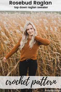 a woman standing in tall grass with her arms behind her head