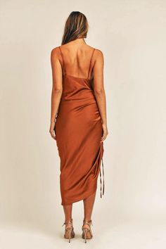 You're the life of the party in this fabulous slip dress that features a front side ruching drawstring detail, adjustable straps and sleek satin fabric. -Available in Royal Blue, Black & Camel -Adjustable spaghetti straps -Cowl neck -Front side ruching drawstring detail -Stretchy -Unlined -Content: 95% Polyester 5% Spandex -Imported -Runs true to size -Model is wearing a size Small Ruched Satin Slip Dress For Date Night, Ruched Slip Dress With Spaghetti Straps For Date Night, Summer Satin Dress With Ruched Back, Satin Slip Dress With Ruched Back For Date Night, Satin Midi Dress With Spaghetti Straps And Ruched Detail, Ruched Satin Midi Slip Dress, Satin Ruched Midi Slip Dress, Midi-length Ruched Satin Slip Dress, Silk Ruched Slip Dress For Date Night