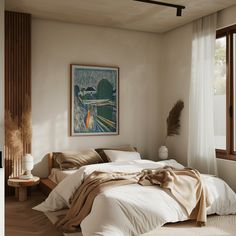 a bedroom with a large bed covered in white sheets and blankets next to a window