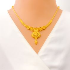 Weighing 23.5 grams, this 22k yellow gold necklace set showcases an impeccable artistic floral design that exudes elegance and creativity. The necklace, measuring 16 inches with a 1.25-inch drop, features intricately crafted floral motifs that add a touch of sophistication. With adjustable 0.75-inch links and a secure hook lock, it ensures both comfort and flexibility. The set includes matching earrings, each 1.5 inches in length, with screw-back posts for a secure fit. Perfect for special occas Yellow Gold Plated Necklaces With Intricate Design, Yellow Gold-plated Necklaces With Intricate Design, Yellow Gold 22k Jewelry Sets For Gift, Elegant 22k Gold Yellow Temple Necklace, Hand-set 22k Gold Necklace, Gold-plated Yellow Necklaces With Intricate Design, 22k Gold Filigree Yellow Necklaces, Yellow Gold-plated Filigree Necklace, 22k Dual-tone Yellow Gold Necklaces