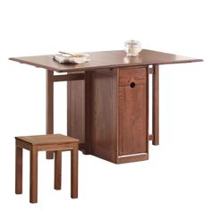 a wooden table with two stools and a small cabinet on the bottom one side