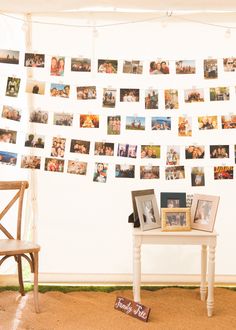 a white table with pictures on it next to a chair