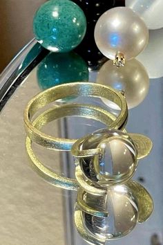 Rare 14k BRUTALIST MODERNIST POOLS OF LIGHT ROCK CRYSTAL GLASS ORB Ring!  in excellent condition! arrives in jewelry case and can be gifted immediately! crafted in solid 14k yellow gold and comes with 10 different gemstone spheres - each approx 10mm. there are natural gem orbs:  -moonstone with blue sheen (the moonstone is approx 7.55Ct please see photo for its carat weight), -South Sea Pearl wit diamond, -agate - eye like pattern( please see photos),  -lapis,  - golden sand stone,  -amethyst, Gold Moonstone Ring In 14k Gold, Modern Gold Moonstone Ring For Formal Occasions, Modern Gold Moonstone Anniversary Ring, Modern Yellow Gold Round Moonstone Ring, Unique Gold Moonstone Open Ring, Unique Gold Moonstone Ring With Open Design, Gold Moonstone Crystal Ring, Unique Gold Crystal Ring, Gold Moonstone Ring For Formal Occasions