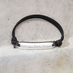 Ideal for everyday wear, our Men's Personalized Identity Bracelet features an adjustable colored cord and can be personalized with a hand-engraved message, date or name.925 Sterling Silver3”x 0.3”x 0.1” rectangular plateBraid made of durable, colorfast polyesterSize: between 8-9, fully adjustable sliding knot fasteningHand-engraved in our Paris studioSent with love in a complimentary gift boxAny slight variations in lettering depth, spacing and alignment from the examples shown are part of the a Reverse Braid, Adjustable Sliding Knot, Message Of Love, Silver Bar, Engraved Bracelet, Sliding Knot, Personalized Bracelets, Silver Bars, Love Messages