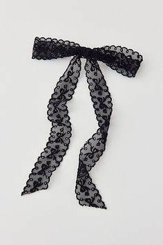 Femme hair barrette topped with a sheer lace bow for a coquette cool look. Features Medium lace hair bow barrette Lace bow barrette Sheer lace Long bow style Secure barrette back with long sheer lace Content + Care Mixed metal, nylon Hand wash Imported | Medium Lace Hair Bow Barrette in Black, Women's at Urban Outfitters Bridesmaid Hair Bows, Crochet Hair Bow, Lace Hair Bow, Black Hair Bow, Crochet Hair Bows, Black Hair Bows, Long Bow, Bow Barrette, Headband Black