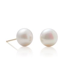 Simple statements of elegance, pearls have been a mainstay in Gump's fine jewelry assortment for decades. Revered for their alluring luster and classic beauty, they are widely recognized as symbols of purity, integrity and wisdom gained through experience. To create these earrings, each pearl is carefully selected for quality, color and shape. Freshwater cultured button pearls, 10mm. 14-karat yellow gold. Pierced only. Luxury Round Pearl Drop Earrings, Classic Round Akoya Pearl Earrings, Elegant Round Everyday Luxury Earrings, Formal White High Luster Pearl Earrings, Elegant Everyday Luxury Round Earrings, Timeless Pearl Earrings As Gift, Classic White Pearl Earrings For Formal Occasions, Classic Yellow Gold Bridal Earrings, Classic Round Pearl Drop Earrings