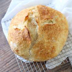 a loaf of bread sitting on top of a cooling rack