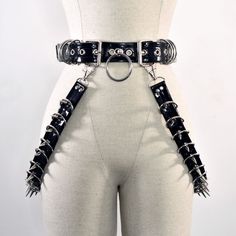 This product is a handmade double buckle belt with two customized attachable swings, created from faux leather/vegan leather. All metal accessories are made of stainless steel (spikes, rivets, D-rings, chain, lobster claw). Swing Sizes (sold as pairs): Small (14 inches) Medium (18 inches) Large (24 inches) X-Large (30 inches) #crimsyn #drag #belt #leather #vinyl #fauxleather Double Buckle Belt, Emo Outfits, Punk Outfits, Alt Fashion, D Rings, Metal Accessories, Gothic Outfits, Goth Outfits, Garters