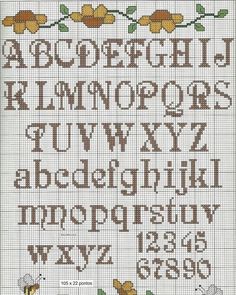 a cross stitch alphabet with flowers and leaves on the bottom, in brown and yellow