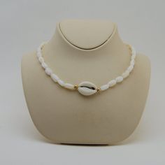 This beautiful choker is hand made with Cowrie seashell, mother of pearl beads cowrie sea shell choker necklace, natural shell All my jewelery is hand crafted with pure and 925 sterling silver , this is a safe way for you to store necklace will be sent along with a beautiful gift box and pouch Adjustable White Cowrie Shell Necklace, White Beaded Choker For Vacation, White Strand Choker For Beach, White Shell Choker Necklace For Beach, White Shell Choker For Beach, White Shell-shaped Choker For Vacation, White Shell-shaped Choker For The Beach, White Shell-shaped Choker For Beach, White Shell Choker For The Beach