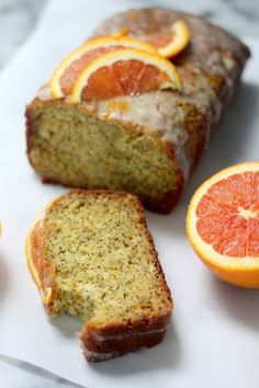 slices of orange and poppy seed bread with blood oranges on the side for garnish