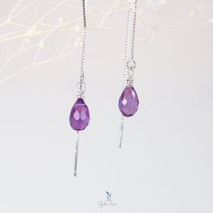 Bring some elegant-minimalistic flair to your jewelry collection with these ethereal teardrop Amethyst ear threaders. Made from a beautiful faceted natural Amethyst stone and delicate 925 sterling silver box chain threaders, these earrings are the perfect gift for yourself or a loved one. Amethyst is known as a protective stone, capable of easing both physical and mental distress. It is also highly regarded as a spiritual stone, promoting selflessness and spiritual wisdom. These Amethyst ear thr Amethyst Teardrop Necklace For Healing, Spiritual Teardrop Amethyst Jewelry, Unique Amethyst Teardrop Earrings, Purple Amethyst Teardrop Crystal Earrings, Faceted Teardrop Amethyst Jewelry, Ear Threader, Amethyst Healing, Silver Box, Amethyst Jewelry