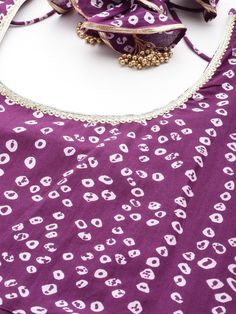 Grab this beautiful 2-piece set. The set comes with bandhani print anarkali kurta has round neck with dori & tassels, long sleeves & calf length teamed with silk chiffon dupatta with lace detailing. Color - Violet Kurta Fabric-Cotton Dupatta Fabric - Silk Chiffon Neck-Round Neck with Dori & Tassels Sleeves-3/4th Sleeves Work - Bandhani Print Detailing Washing Instructions-Hand Wash DISCLAIMER - The color of the product may be differ due to screen settings of device. A misprint here and a color d Cotton Silk Bandhani Print Straight Kurta, Purple Bandhani Print Dupatta For Festivals, Purple Bandhani Dupatta, Festive Bandhani Print Maxi-length Dupatta, Purple Bandhani Print Dupatta, Formal Jewelry, Anarkali Kurta, Casual Party, Churidar