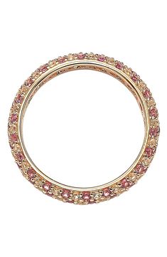 an image of a gold colored bang bracelet with pink and white stones on it's sides