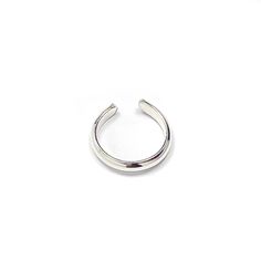 * Sterling silver mini ear cuff, approx. 10mm in diameter, perfect for upper ear. * Handcrafted out of 14 gauge half round wire, approx. 2mm wide, 1mm thick. * Adjustable which means one size fits all. No piercing required. * Our jewelry is packaged in a cute pillow box or envelope. You can also request a personal message which we hand write onto a gift tag. We try to package responsibly in an effort not to waste. Often more than one item will be placed in the same box. Please specify if you wou Helix Ear, Wrap Earrings, Silver Ear Cuff, Ear Cuff Earings, Pillow Box, Cuff Earrings, Gift Tag, Minimalist Jewelry, Personal Message