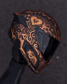 the helmet is decorated with intricate designs