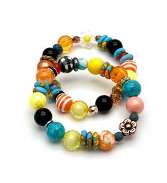 This is a 120% happy and uplifting bracelet combo, mainly saturated bright shades of sky blue and turquoise, orange and yellow.  Check out the different patterns also.  Sweet embellishments of rhinestone and mixed metals also... I am betting color affects us more than we might admit.  Face it, most of us are moved by color and often will seek out a favorite color combo = perhaps this is one of yours.    OOAK/one of a kind as usual.  Enjoy my classic boutique style.  And check out all the little timeless details.  Forever in style. ►►These currently fit a 6 inch wrist.  If you need an adjustment, please measure wrist with fabric tape measure or string and Etsy convo me so that we can discuss prior to purchase. ►►Special request?  If you are seeking a similar type bracelet but in specific co Orange Bangle Bracelet With Colorful Beads, Vibrant Adjustable Yellow Beaded Bracelets, Orange Stackable Bracelets With Round Beads, Stackable Orange Round Beaded Bracelets, Adjustable Vibrant Blue Jewelry, Vibrant Adjustable Blue Jewelry, Vibrant Blue Adjustable Jewelry, Multicolor Stackable Spiritual Beaded Bracelets, Vibrant Yellow Beaded Bracelets As Gift