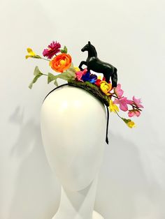 "Horse Fascinator- Day at the Races- Racing Headpiece - Mad Hatter- Kentucky Derby- Racing Fashion Hi,    This piece has a beautiful collection of flowers on a faux green moss is about 4\" wide. The black plastic horse is about 3\" high and 4\" long .  It's placed on the top of a skinny  1/4 \" satin covered headband that fits any adult head size.    -------------------------------------- If you like this try bigger version:  https://doramarra.etsy.com/listing/514762174 ------------------------- Multicolor Mini Hat Headband For Spring, Spring Multicolor Headpieces For Garden Party, Multicolor Headpieces For Spring Garden Party, Spring Garden Party Multicolor Headpieces, Spring Races Headpiece With Structured Crown, Black Mini Hats For Spring Garden Party, Spring Racing Headpieces With Pinched Crown, Spring Races Headpieces With Pinched Crown, Spring Races Headpiece With Pinched Crown