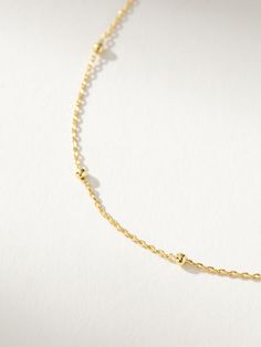 Instead of going round and round with your necklace stack, make this everyday chain necklace your go-to staple. Crafted with a dainty chain and gold bead details, our Satellite Chain Necklace is the ultimate layering necklace. For an effortless everyday look, pair this silver or gold necklace with anything from our Dainty Jewelry Collection. Minimalist Beaded Chain Layered Necklace, Minimalist Everyday Beaded Chain Layered Necklace, Delicate Satellite Chain Necklace For Everyday, Dainty Station Necklace With Satellite Chain, Minimalist Satellite Chain Necklace For Layering, Dainty Ball Chain Necklace For Everyday, Dainty Everyday Ball Chain Necklace, Dainty Everyday Satellite Chain Necklace, Everyday Minimalist Ball Chain Necklace