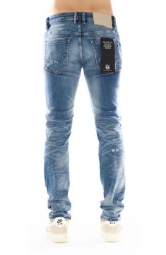 Slim-fitting stretch jeans feature a dimensional medium wash, subtle distressing and signature stitching at the back leg for an everyday edgy look. Zip fly with button closure Five-pocket style 98% cotton, 2% spandex Machine wash, line dry Imported Urban Style Distressed Fitted Jeans, Urban Distressed Fitted Jeans, Slim Fit Medium Wash Jeans, Medium Wash Slim Fit Jeans, Distressed Fitted Medium Wash Jeans, Distressed Fitted Jeans In Medium Wash, Fitted Washed Blue Jeans With Five Pockets, Fitted Distressed Jeans For Everyday Wear, Everyday Fitted Distressed Jeans