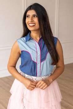 This Western-inspired piece seamlessly blends sweet southern charm with a touch of sophistication. The classic pearl snaps and sleeveless design makes this the perfect top to keep you cool in the Summer months. Embrace the cool cowgirl vibes this Summer with your new favorite top. Material: 100% CottonFit: RelaxedOur model is wearing a size small Cool Cowgirl, Cowgirl Vibes, Rugged Design, Dance Floors, Southern Charm, Summer Months, Dance Floor, The Cool, Country Style