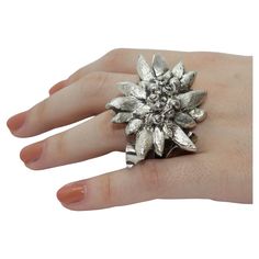 The "Edelweiss" ring is part of our jewelry collection. All our sterling silver pieces of jewelry are handmade: it means that none is like the other. As a matter of fact, our aim is to create unique products with a high artistic value. Indeed, all products have been crafted in our studio by the best Florentine master goldsmiths. In particular, this ring has been chiselled by Giuliano Foglia, an artist that is currently working at our project: K-Over, Works of art. Edelweiss Jewelry, Stella Alpina, Unique Products, Silver Pieces, Ring Sterling Silver, Works Of Art, An Artist, Sterling Ring, Fashion Rings