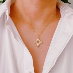 This Square Pearl Cross Necklace features a unique cross shape and classic pearl detailing, giving it a timeless and elegant look. Its versatile design allows for layering, making it a perfect addition to any outfit. Dimensions: approximately 16" chain with a 2" extender, pendant 1" drop Gold plated metal, acrylic pearl Lead and Nickel compliant Pearl Cross Necklace, Cross Shape, Hair Setting, Scrunchie Hairstyles, Headband Hairstyles, Hair Accessories Headbands, Stainless Steel Jewelry, Winter Collection, Different Styles