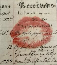 an old document with red lipstick on it