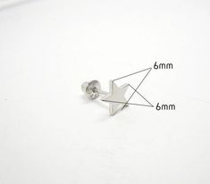 This earring is comprised of 92.5% Sterling Silver and is Rhodium plated to improve the finish and appearance of the earring. Process of Rhodium plating allows for a brighter finish, similar to white gold, and it helps to prevent tarnish which is prevalent in silver, while providing the added benefit of being scratch resistant. The earring is secured by a screw back, which needs to be screwed onto the pin behind the earlobe, as opposed to being pushed into the backing. This also provides added s Nickel-free Star-shaped Silver Piercings, Nickel Free Silver Star-shaped Piercing, Nickel-free Silver Star Piercings, Silver Star Single Stud Earring, Hypoallergenic Adjustable Star Earrings, Nickel Free Star Shaped Silver Cartilage Earrings, Screw Back Earrings, Rhodium Plated