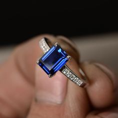 This is a gorgeous handmade creation. Its beauty is its simplicity & Elegance. The 6*8mm emerald shape faceted lab sapphire is crafted in solid sterling silver and with rhodium plated. All item is sent in a beautiful gift box You can realize more lovely stuff clicking the link https://www.etsy.com/shop/knightjewelry?refshopsection_shophome_leftnav Please leave the correct address and you phone number for delivering successfully. Sapphire Anniversary Ring, Sapphire Anniversary, Blue Diamond Engagement Ring, September Birthstone Rings, Nice Jewelry, Sapphire Solitaire, Emerald Engagement Ring Cut, Sapphire Engagement Ring Blue, Gemstone Engagement