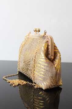 The evening bags and Designer wedding clutch are a unique piece of the Olga's Luxury Creation. They will sublimate you during your galas, parties and events. Elegance, style and originality are the key parts of these creations. The use of quality materials, advanced know-how are essential values to offer you the best creations. Our collection of Wedding bag for Wedding day made in France.  All the bags with chain and clasp kiss lock frame.   We work only with French Tapestry and Luxury quality f Luxury Gold Evening Bag For Vintage Events, Luxury Gold Embroidered Evening Bag For Wedding, Handmade Clutch Bag For Events, Handmade Clutch For Events, Elegant Evening Clutch With Gift Bag, Handmade Event Clutch Bag, Handmade Beige Evening Bag For Events, Handmade Beige Clutch For Events, Gold Rectangular Bag For Gala