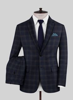 Exude confidence, charm, and lasting sophistication with our Reda Vidla Dark Blue Checks Wool Suit. Crafted from pure wool and adorned with a subtle light brown plaid pattern over the dark blue color, it elevates the ensemble, creating a captivating blend of hues and textures. This suit not only exudes impeccable style but also cocoons you in warmth and luxury all day long. Whether you're the best man at a wedding or attending a meeting, this suit is the perfect choice.  Look Includes   Reda Vid Navy Checkered Suit, Blue Checkered Suit, Blue Plaid Suit, Dark Blue Plaid, Checkered Suit, Suit Pattern, The Best Man, Exude Confidence, Plaid Suit