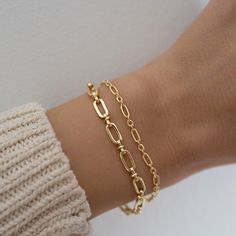 "Beautiful chain bracelet that is sure to attract lots of admirers! Great for stacking or for a minimalist look! - - - D E T A I L S - - - * THICK, durable plating of 14k Gold or Rhodium over brass - for a piece that will be with you for years to come! * Nickel-free & Hypoallergenic * Available in 6.25\", 6.75\", or 7\" + .5\" Ext * Lobster Clasp Closure * Width: 5mm Paperclip Bracelet https://www.etsy.com/listing/1318670980/paperclip-bracelet-chain-bracelet-dainty?click_key=7e78d0a707583ea0328e Paperclip Bracelet, Dainty Gold Bracelet, Bracelet Dainty, Dainty Bracelet, Silver Chain Style, Bracelet Chain, Chain Silver, Bracelet Vintage, Dainty Bracelets