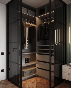 an open closet with clothes on hangers and suitcases next to it's doors