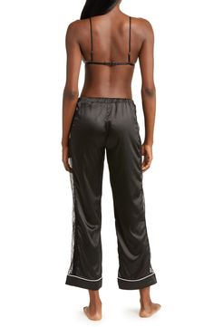 Lace trim accentuates the enchanting appeal of this satin bralette and pants set. Includes bra and pants 97% polyester, 3% elastane Hand wash, line dry Imported Black Satin Loungewear Bottoms, Satin Bralette, Nordstrom Rack, Lace Trim, Bralette, Pants Set, Hand Wash, Nordstrom, Satin