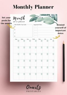 the printable month planner is shown on top of a pink surface with a pencil next to it