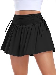 PRICES MAY VARY. Side Drawstring: The adjustable drawstring waist allows for a customized fit, ensuring comfort and freedom of movement. The waist detail cinches in at just the right places, creating a slimming effect that highlights your curves High Waist & Flowy: 14" flowy ruched A-Line skirt with its high elasticity and waist-hugging design, providing tummy-slimming feature and excellent support while discreetly concealing any concerns about the midsection Functional Side Pockets: Cute mini t Workout Skirts, Skirt Tennis, Womens Golf Skirts, Athletic Skirts, Golf Skirt, Athletic Skort, Athletic Skirt, Black Pleated Skirt, Tennis Skirts