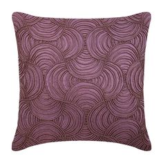 a purple pillow with an intricate design on it