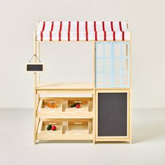 a doll house made out of wooden furniture