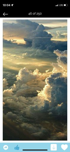 the sky is filled with lots of white and grey clouds, as seen from an airplane window