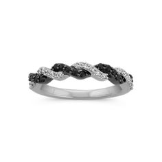 a white gold ring with black and white diamonds