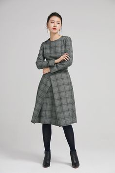 "Retro wool plaid long sleeves dress in classic hues of gray, black and white. This dress features a round neckline,fitted waist, fully lined and a back zipper closure. Details: * plaid wool fabric with fully polyester lining * long sleeves * round neckline * back zipper closure * no pockets * knee length * with buttons decoration * womens dresses, winter dress SIZE GUIDE Size vary between Brand and Country Please get your body measurement with our Size Guide And Find your size in our Size Chart Wool Long Sleeve Midi Dress For Fall, Fall Long Sleeve Wool Midi Dress, Wool Midi Dress With Long Sleeves For Fall, Fall Tweed Midi Dress For Work, Fall Wool Midi Dress With Long Sleeves, Winter Workwear Tweed Midi Dress, Plaid Long Sleeve Midi Dress For Work, Wool Long Sleeve Midi Dress For Work, Elegant Long Sleeve Houndstooth Tweed Dress